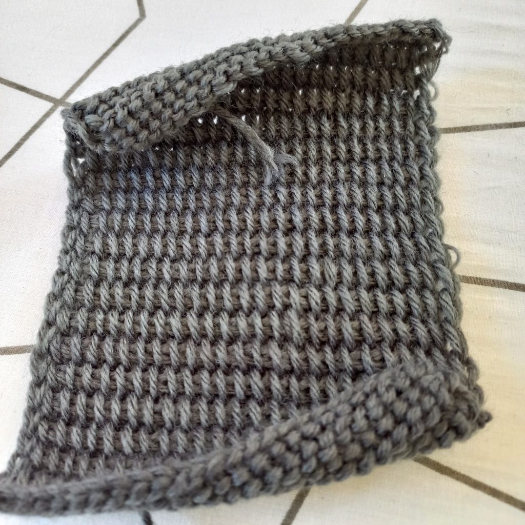 Sample of Tunisian simple stitch with reduced curling.